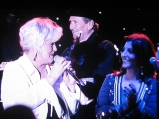 Bonnie as club owner Maggie, backed here by James Burton on guitar, in The Gurdian, 2006